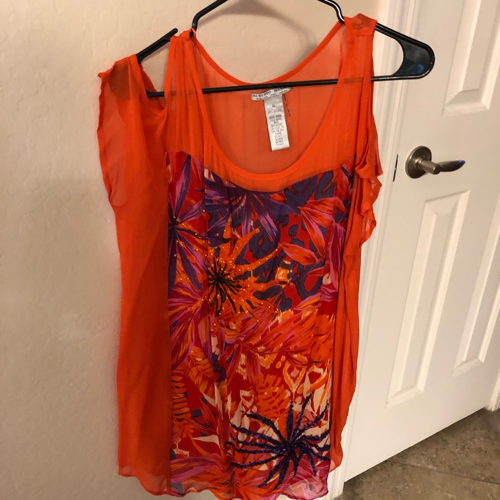 Pretty beaded and colorful top.